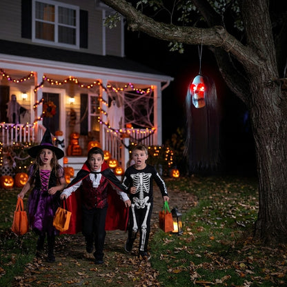 Kids running away from the SkullGaze glowing skull on Halloween night